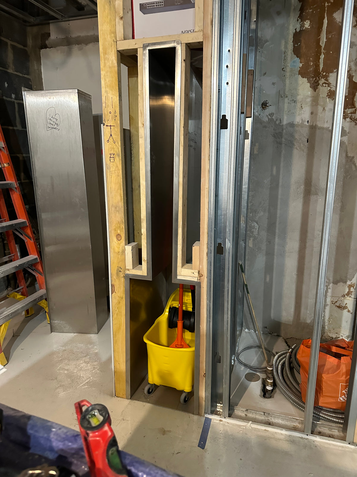 GS#1 Installing s/s mop bucket wall insert.
