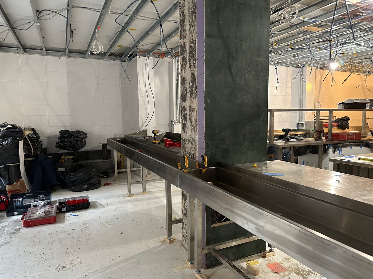 Getting the big ice chests to fit snug around the column meant welding them together on site. I found a 78-year-old welder to do it.