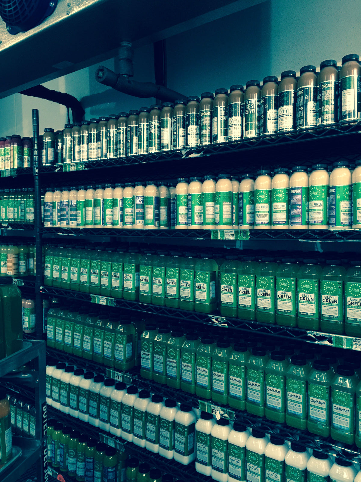 A small corner of our LIC fridge at the end of a production run: handmade, unpasteurized juice. We made about 10,000 bottles a day.