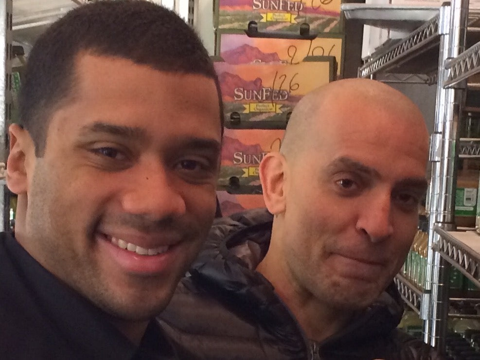 In the JP5 fridge with Russell Wilson, the Seattle Seahawks quarterback, back when he was giving Brady and the Patriots a hard time. Russell later invested in Juice Press for our Seattle location.