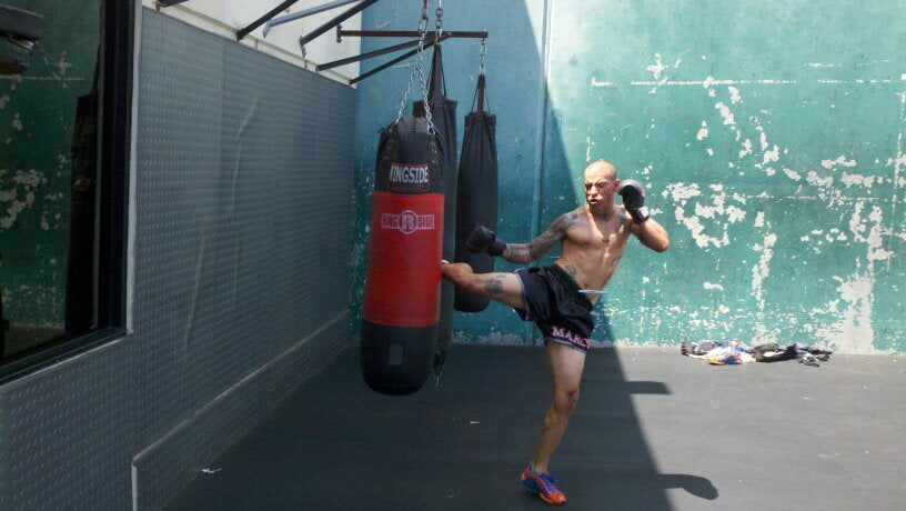 Thai boxing on the bag at Gold’s Gym in Venice Beach. My shorts had my name on them. That was also the last year Brooks made normal running shoes.